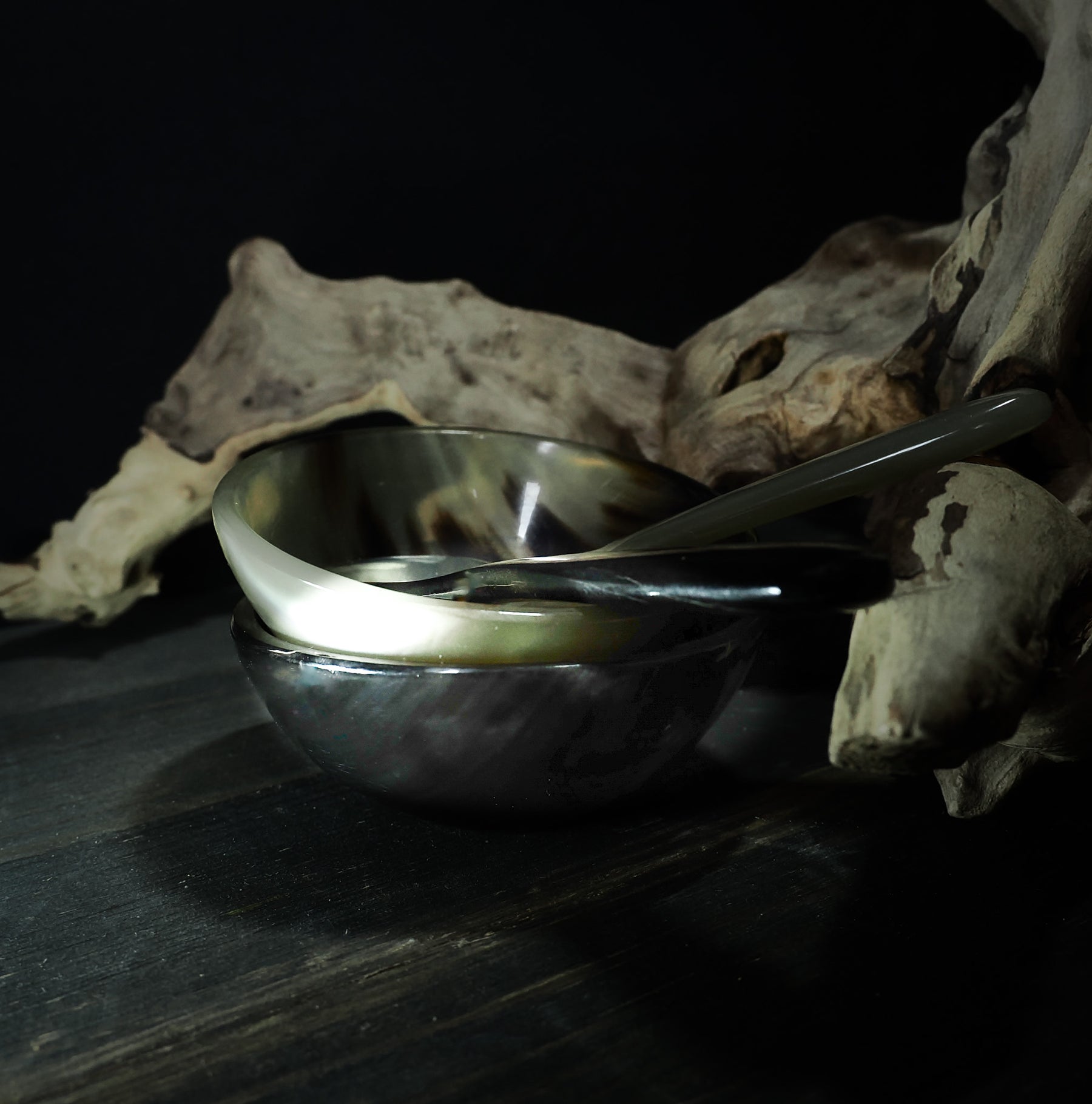 Salt and pepper bowls with spoon.