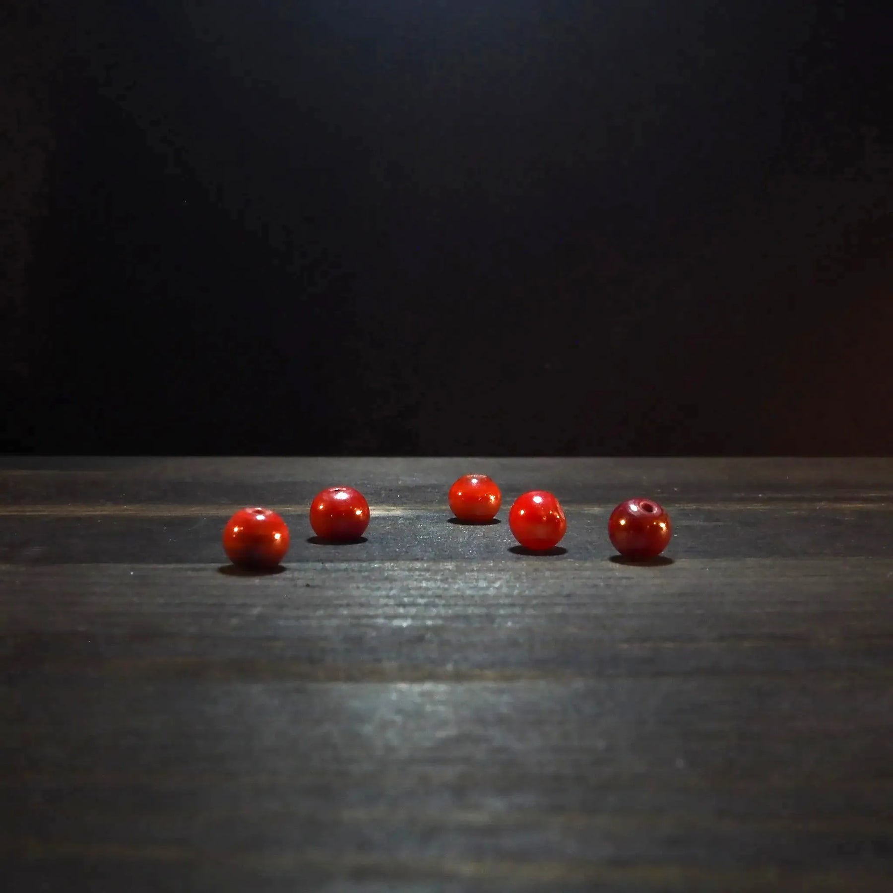 Round red glass bead