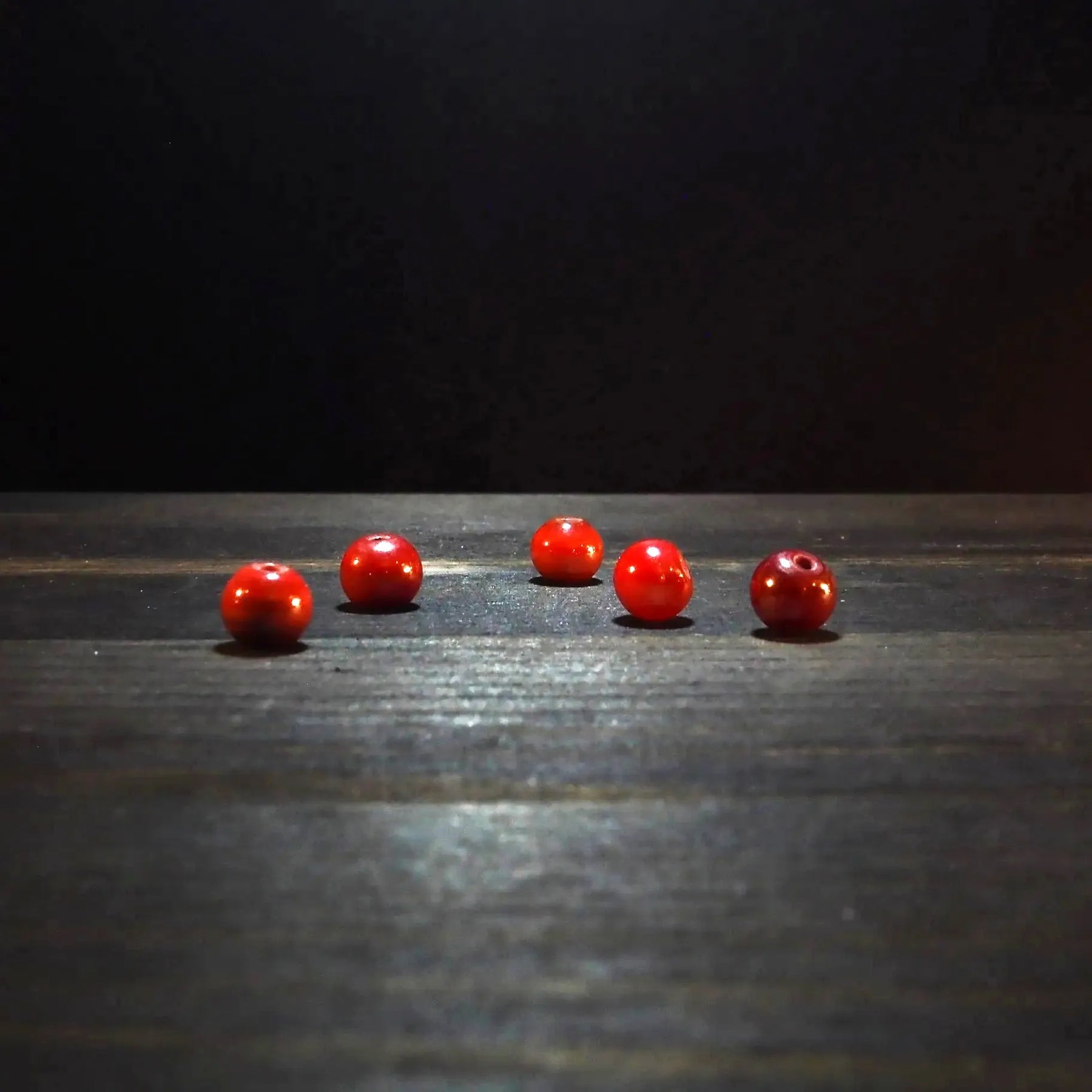 Round red glass bead