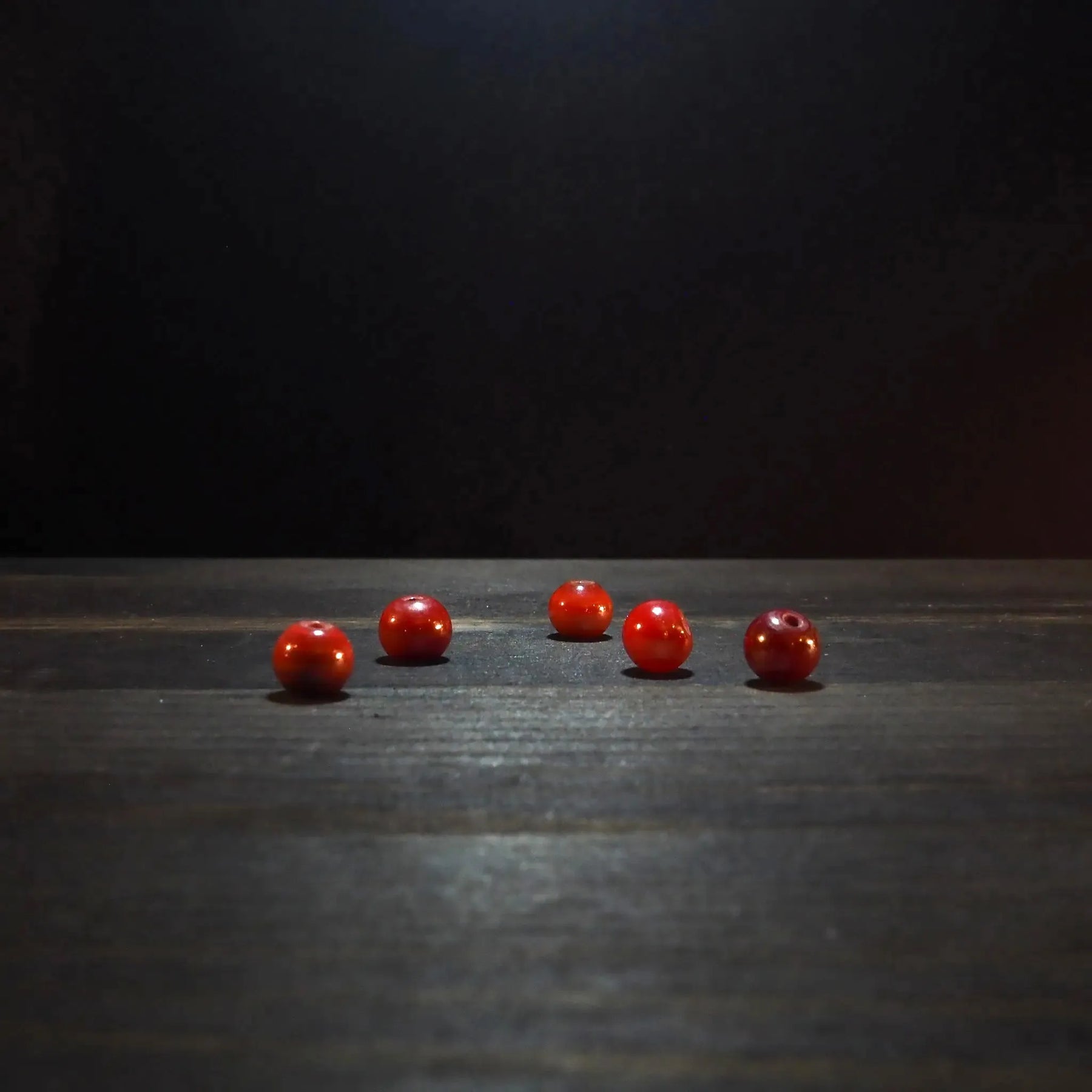 Round red glass bead