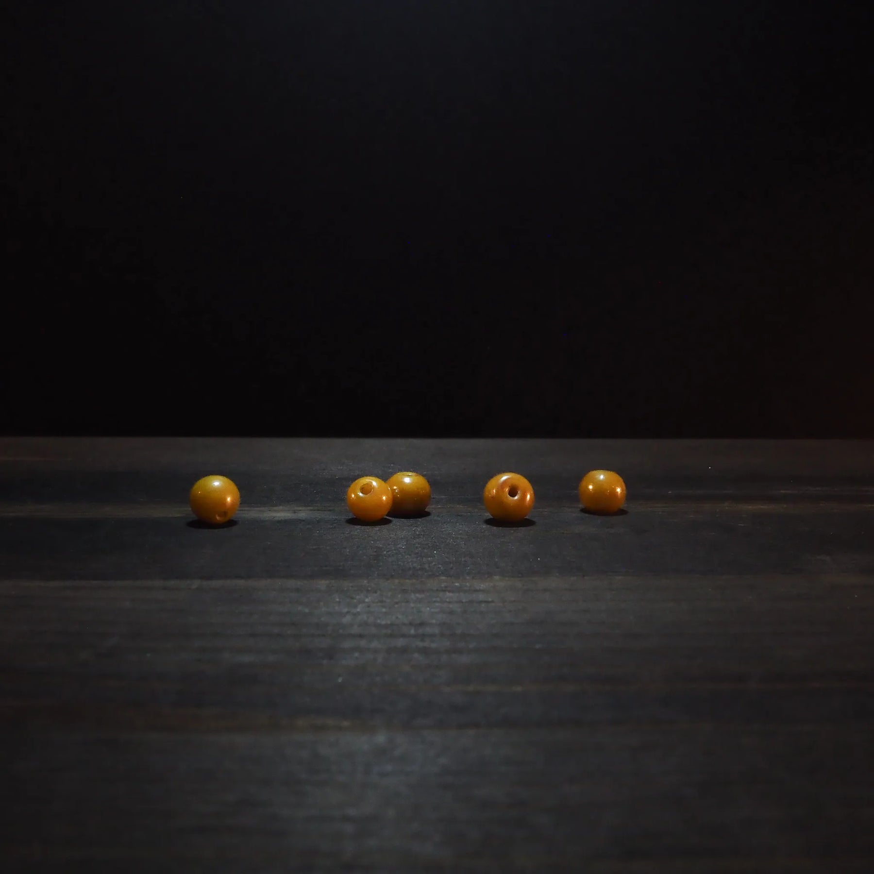 Round yellow glass bead