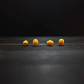 Oval yellow glass bead