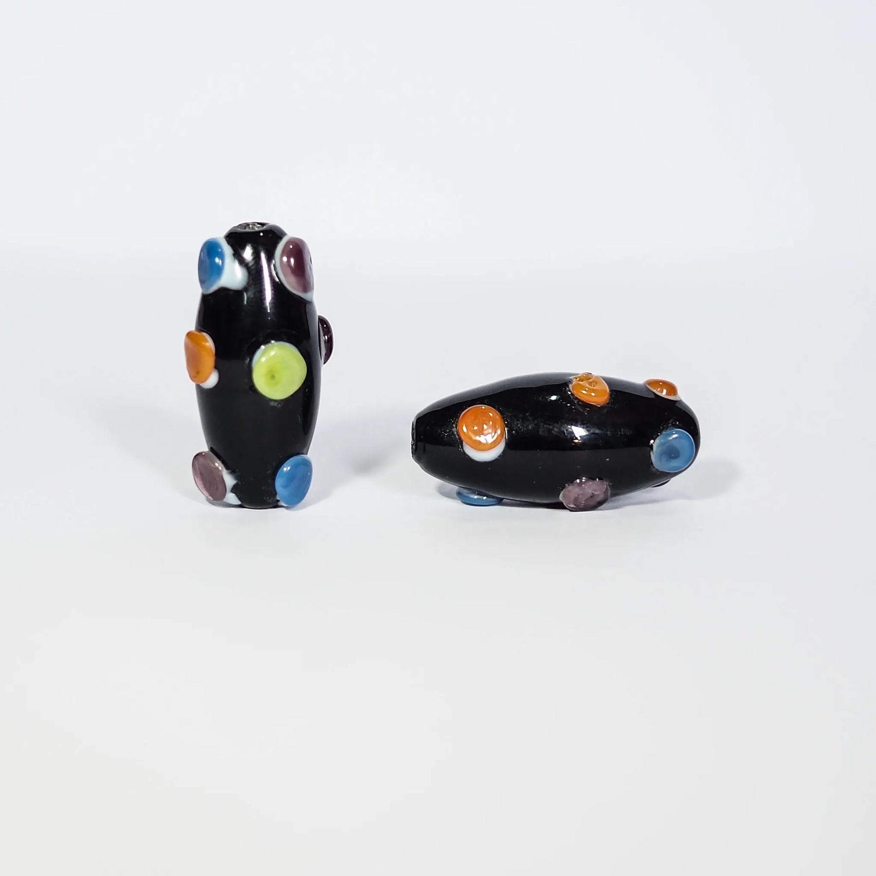 Dark bead with dots in bright colors