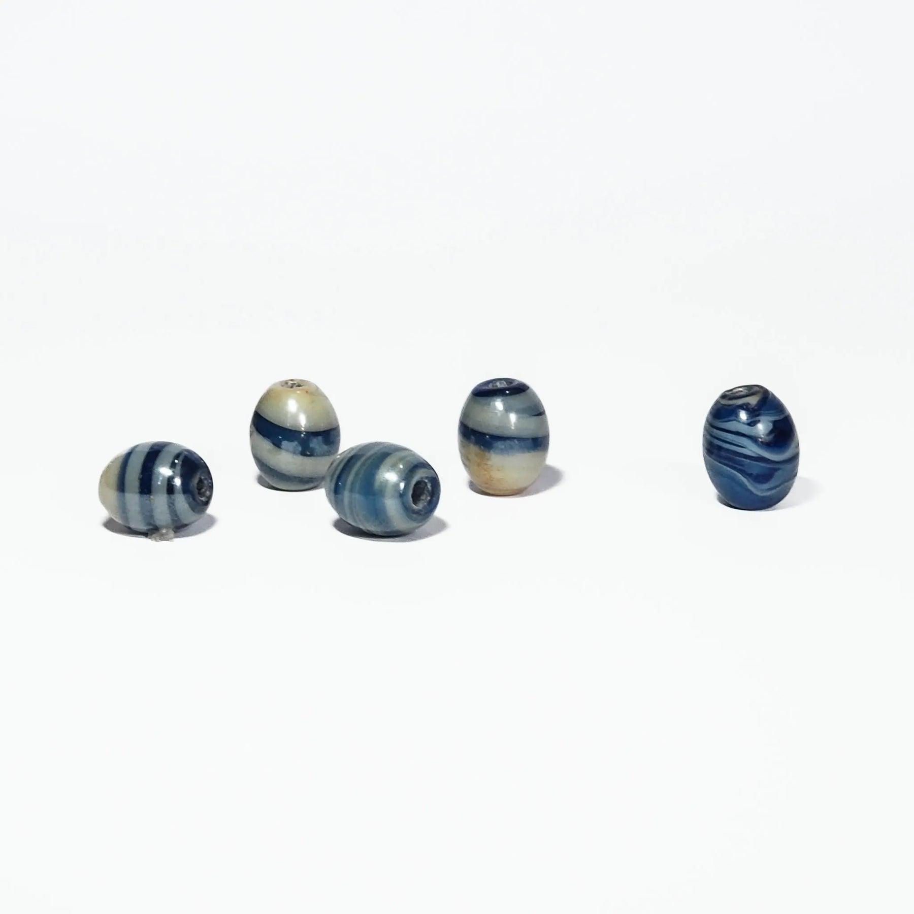 Blue marbled glass bead