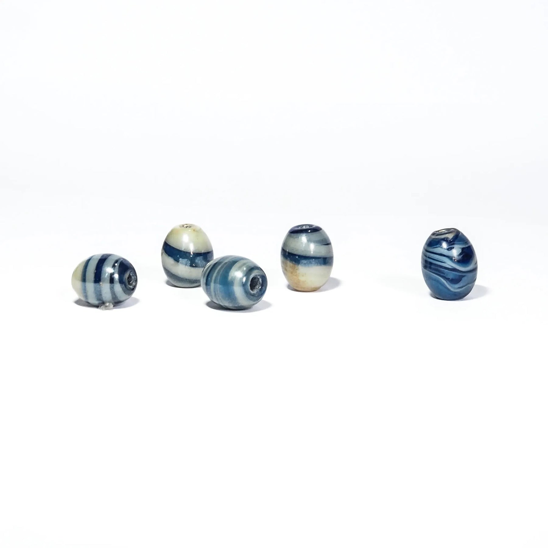 Blue marbled glass bead