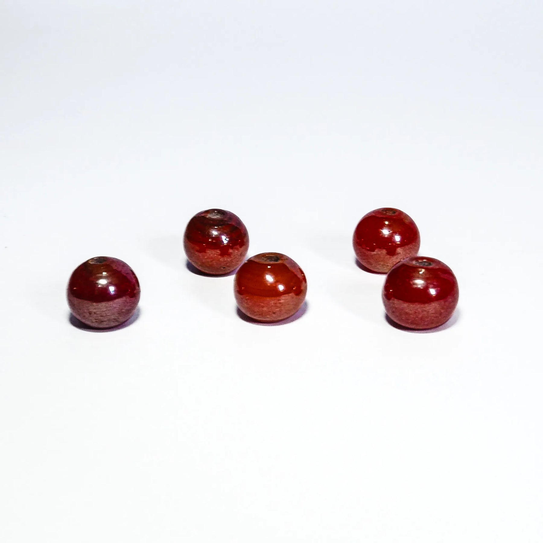 Round red glass bead