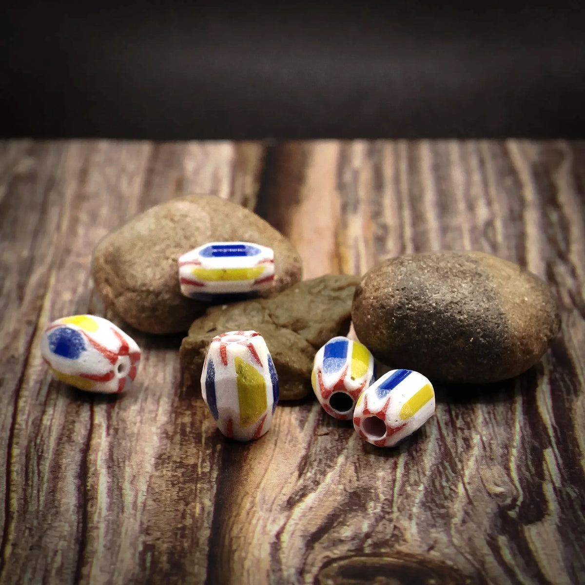 Oval multicolored glass bead – several beads showing the pattern from different angles