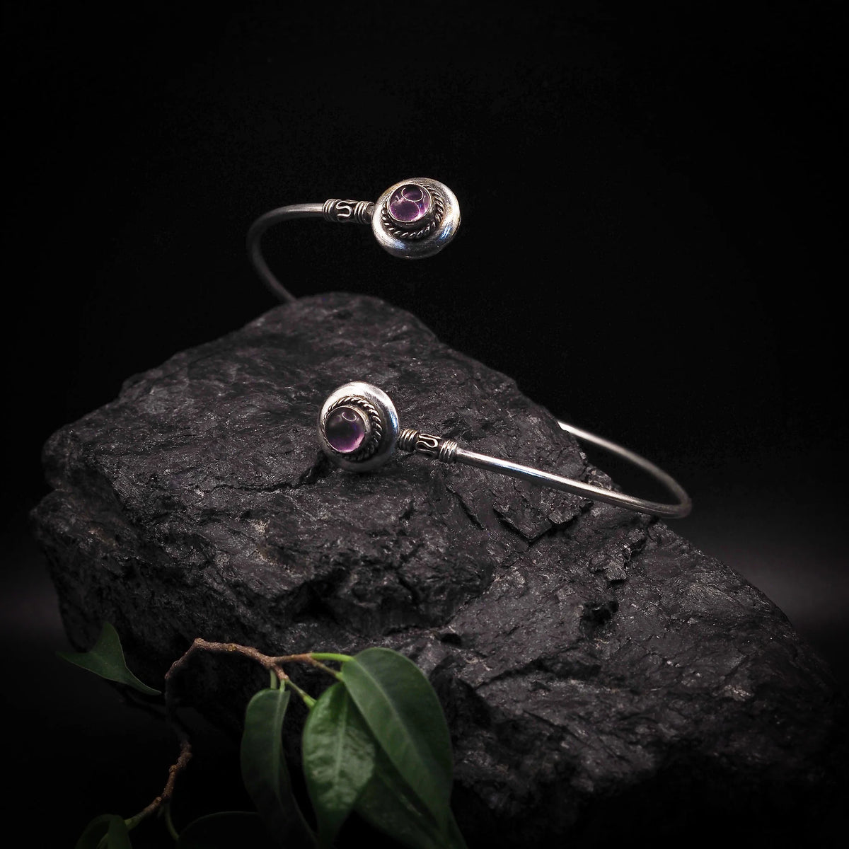 Adjustable upper arm ring with two black agate semi-precious stones in silver-plated brass bezel settings, decorative wire elements