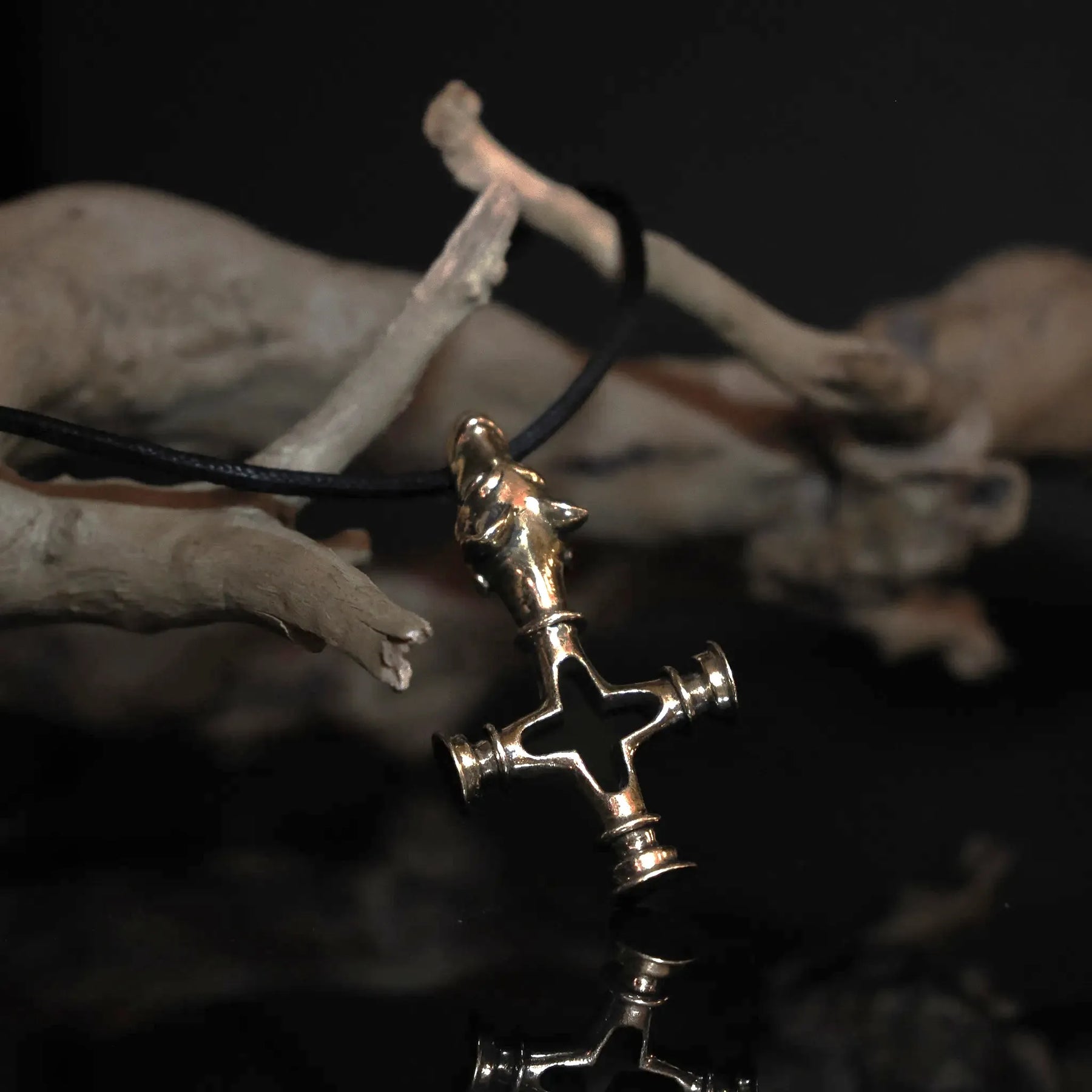 Wolf cross in brass