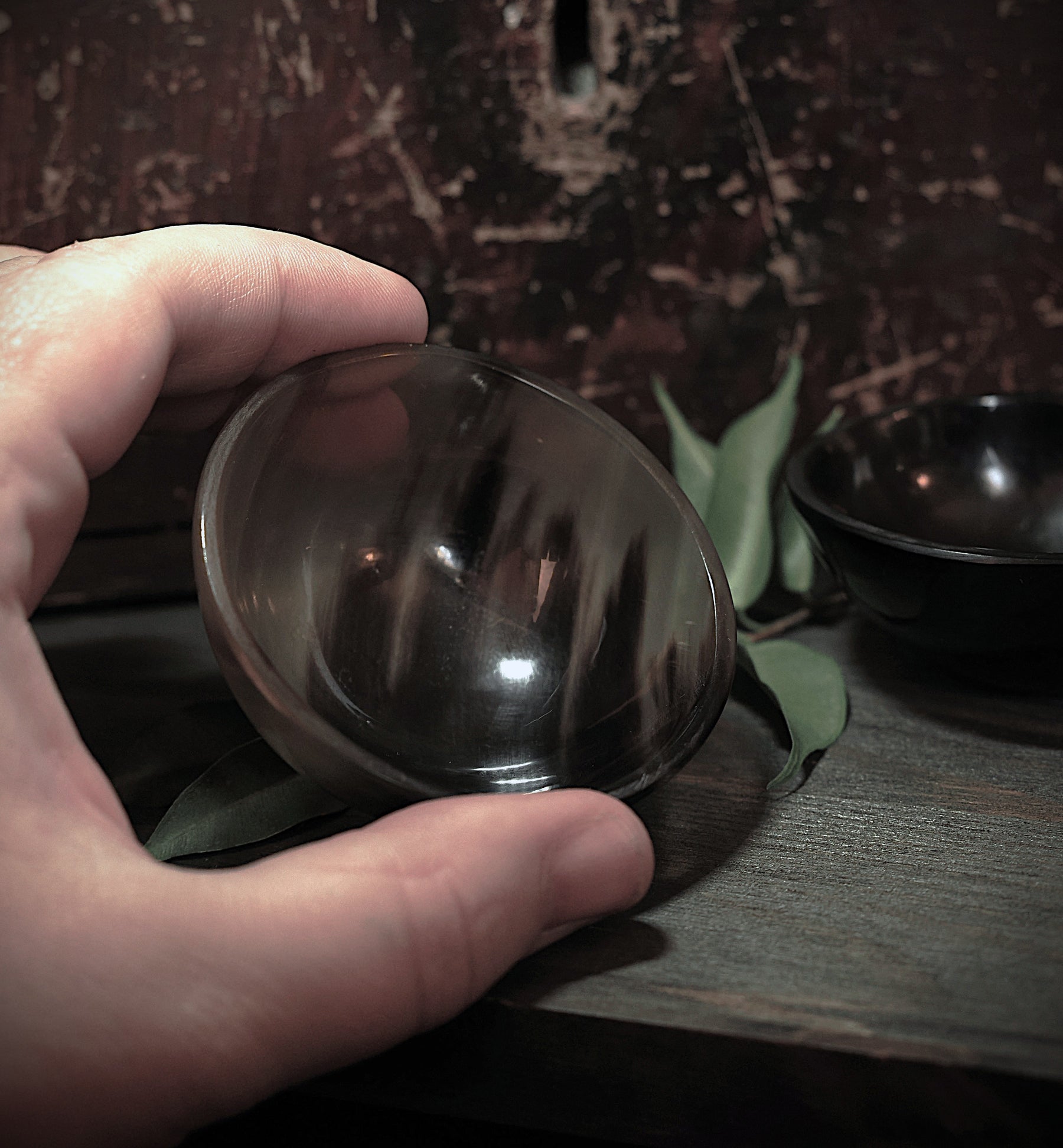 Salt and pepper bowls with spoon.
