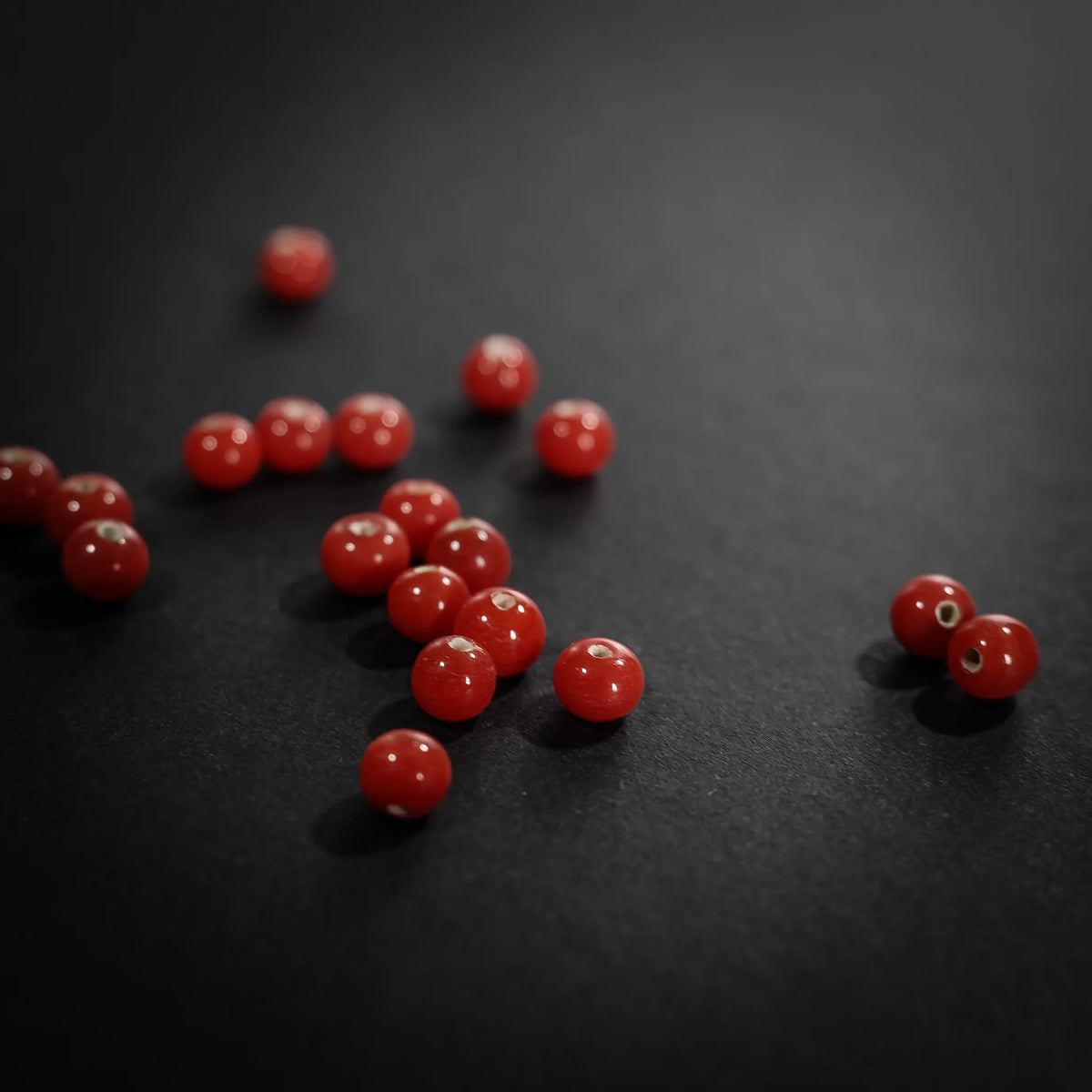 Handmade, small red glass bead