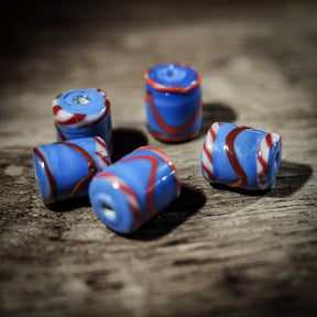 Blue tube-shaped glass bead with red and white pattern – replica of a find in Ribe