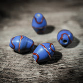 Blue elongated glass bead with red and white decor – 20x16 mm, replica of a find in Ribe