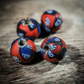 Round mosaic bead, Kiev – mottled glass bead with geometric pattern in red, blue, white and black