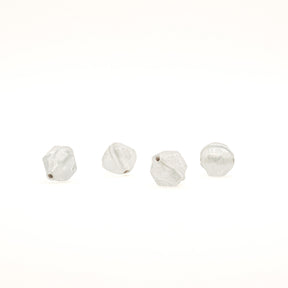 Angular glass bead Birka – four transparent beads in a row, hole visible on two of them