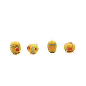 Yellow glass bead Birka – four beads turned at different angles, red dots and turquoise bands from the side