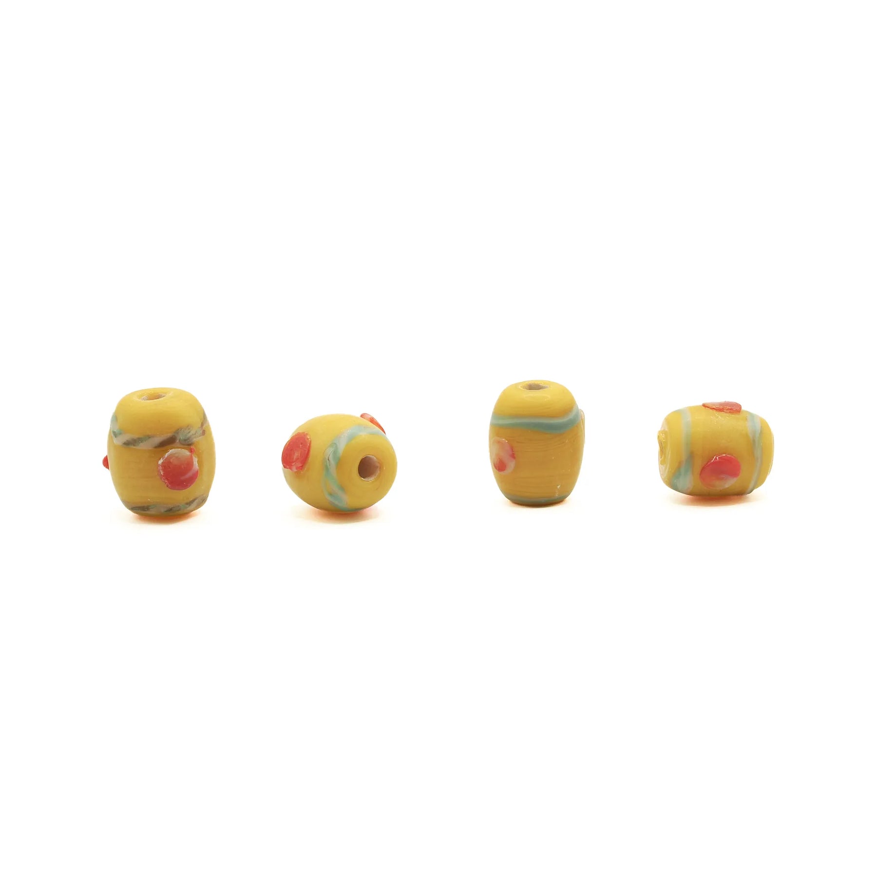 Yellow glass bead Birka – four beads in a row, two standing and two lying, with red dots