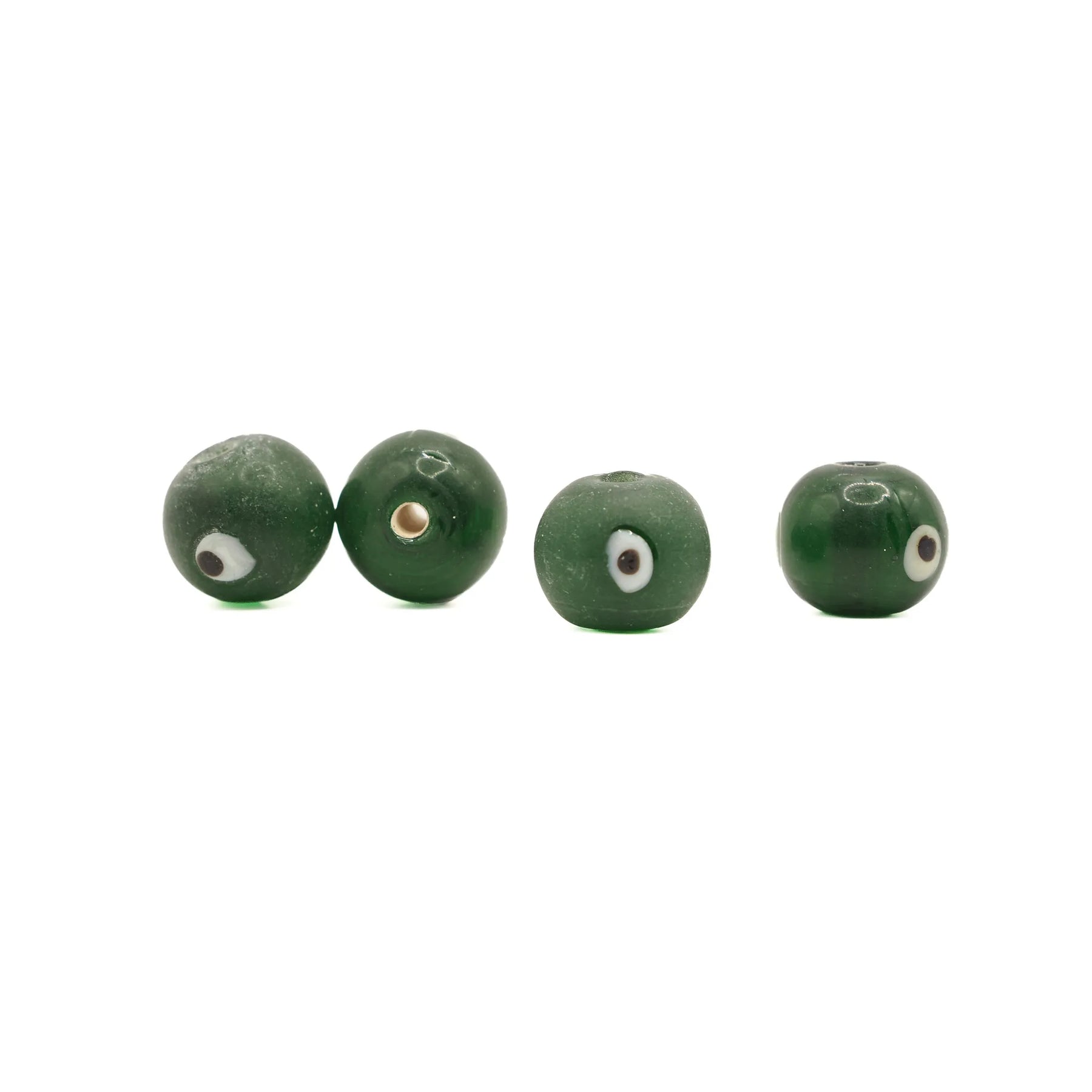 Green glass bead Birka – four beads in a row, white eyes with dark pupil and matt surface
