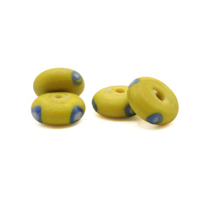Yellow glass bead Ribe – four matt beads from the side, blue eyes on the edges