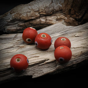 Red glass bead with eye – five beads with eye decoration and visible holes