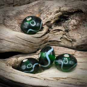 Green glass bead Birka – four beads with winding white decoration and visible hole