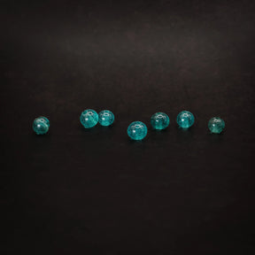 Liten turkis glaspärla