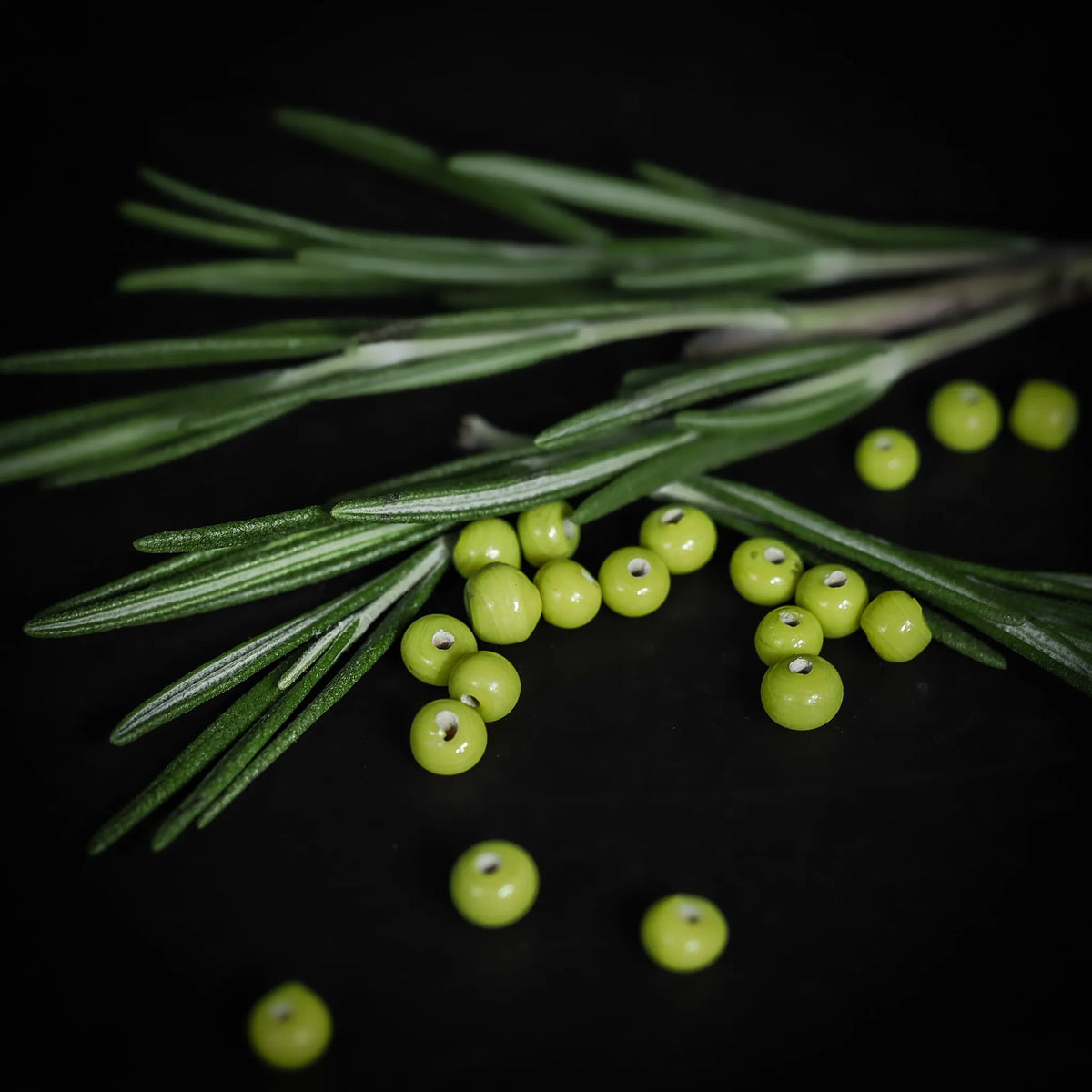 Handmade, small lime green glass bead 07700044