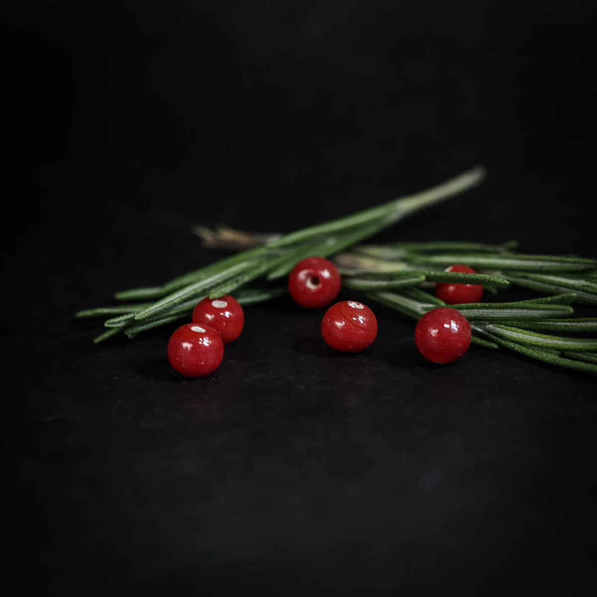 Handmade, small red glass bead
