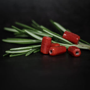 Avlång röd glaspärla