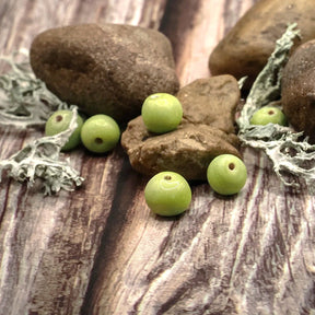 Glass bead, light lime yellow