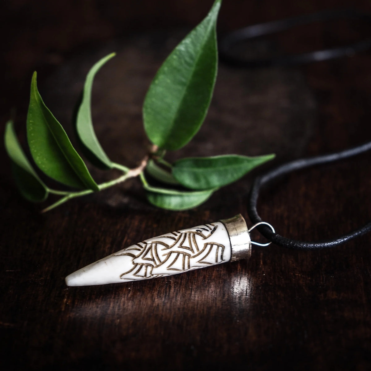 Carved bone pendant