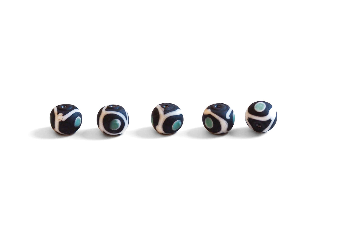 Black glass bead with decor, matt