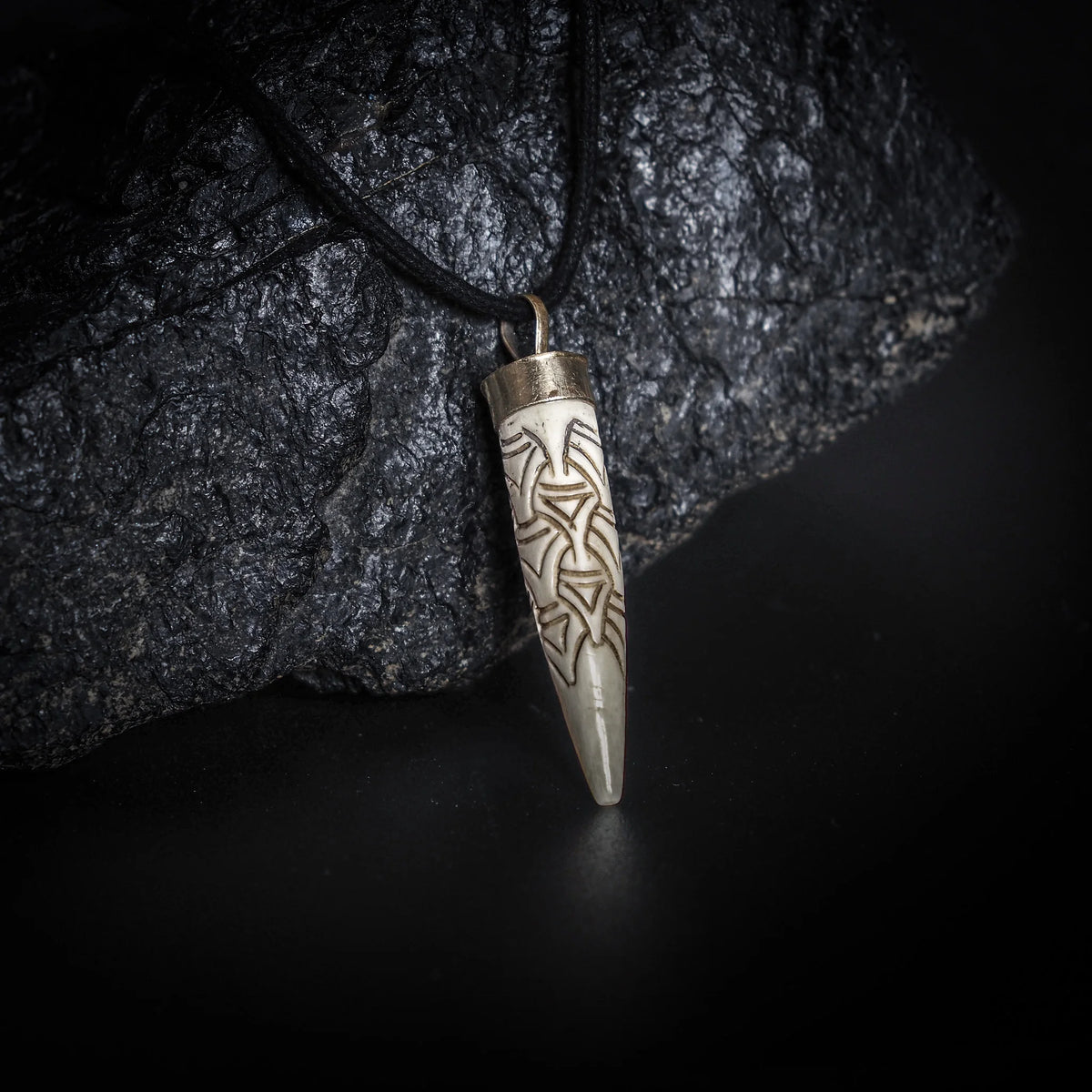 Carved bone pendant