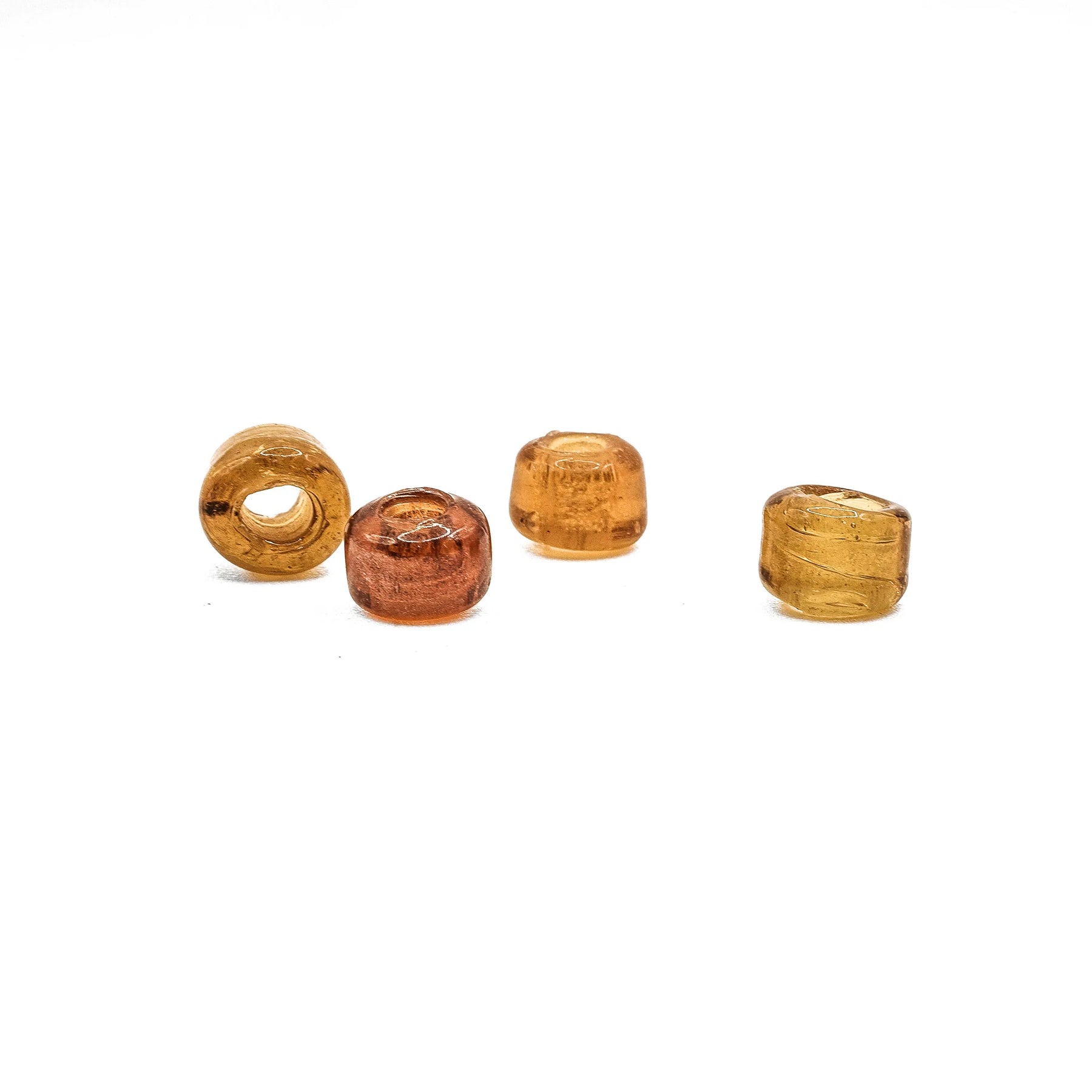 Honey-colored tire-shaped glass bead