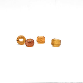 Honey-colored tire-shaped glass bead