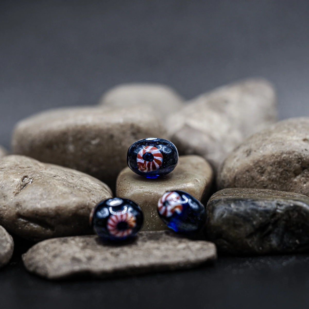 Blue glass bead with red-white eye