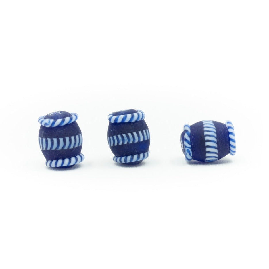 Blue glass bead with white pattern, matte – three beads at different angles