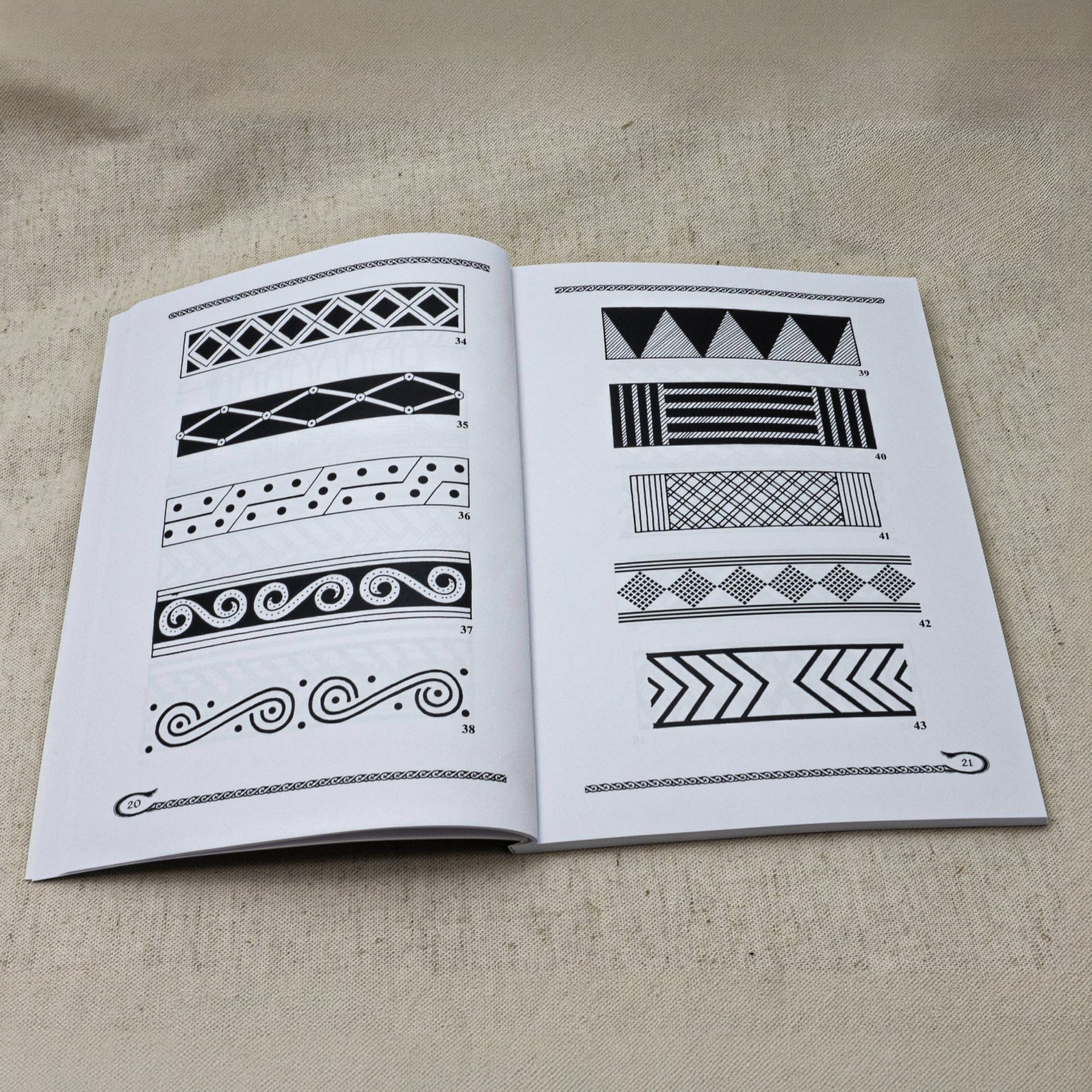 Viking and Slavic Ornamental Design – spread with numbered border patterns 34–43