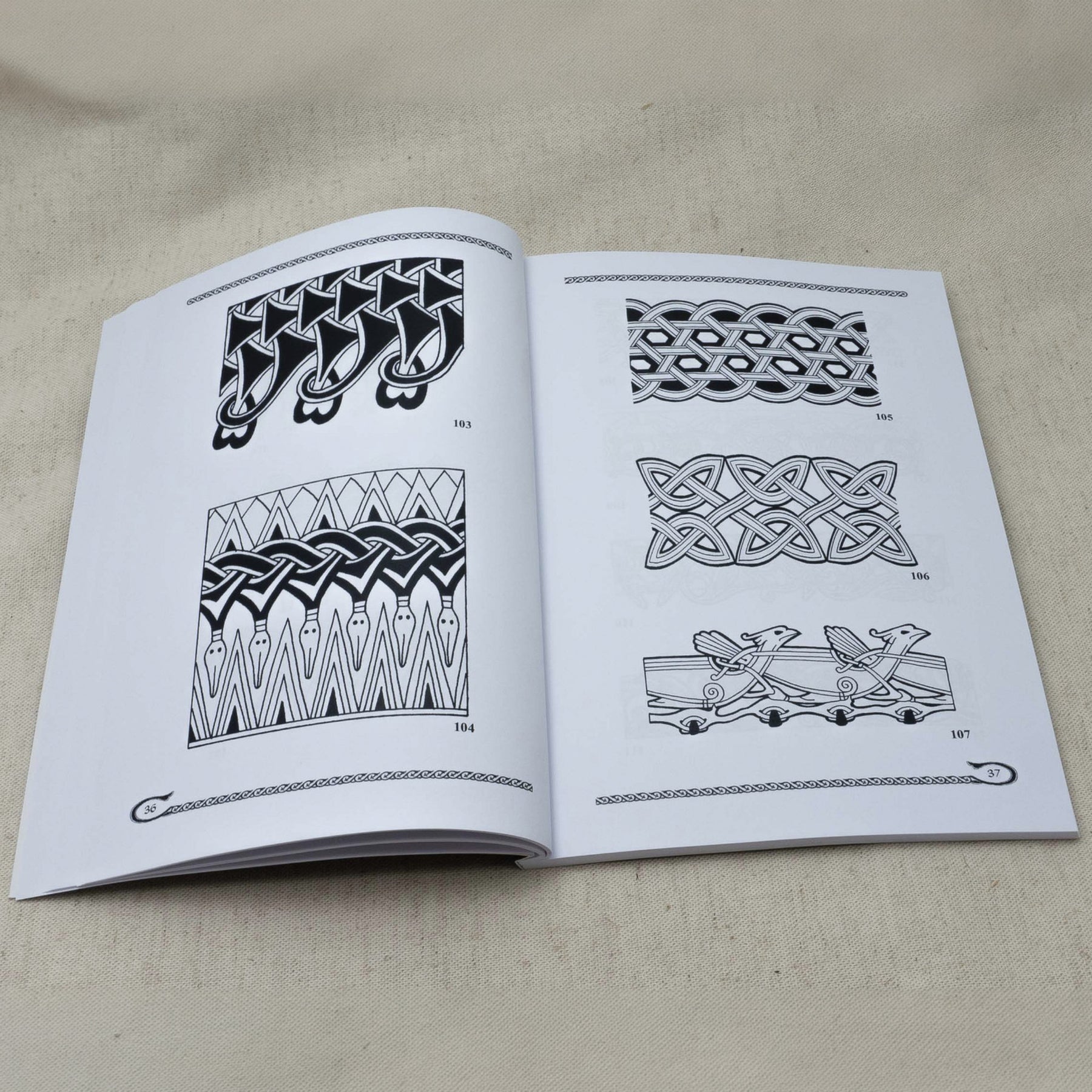 Viking and Slavic Ornamental Design – spread with border patterns 103–107, interlace and animal ornamentation