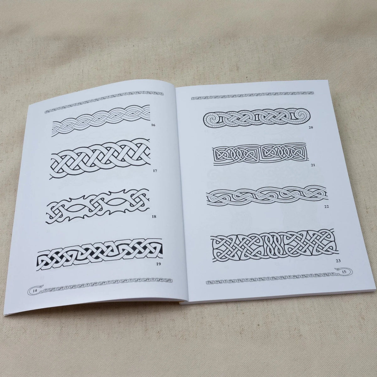 Pattern books vol. 1-4 – spread with braided border patterns from one of the books