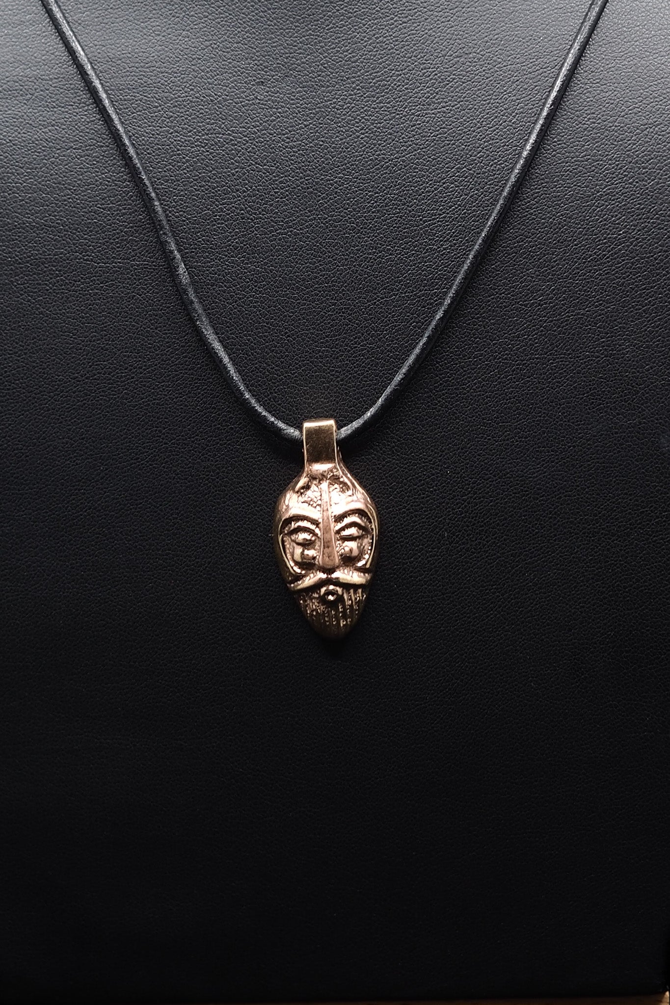 Loki, bronze pendant