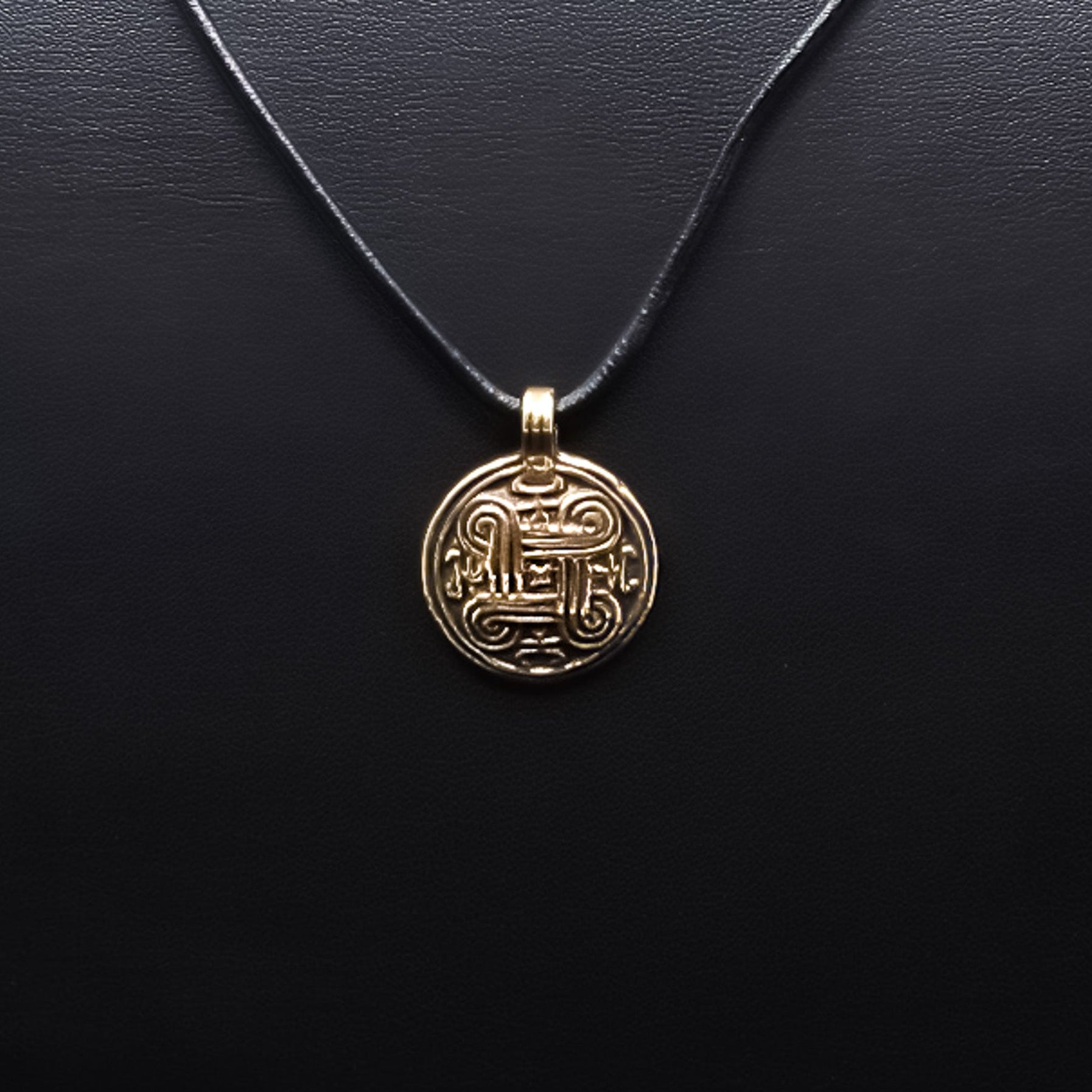 Eternity symbol, bronze – round medallion on a black leather cord, straight from the front