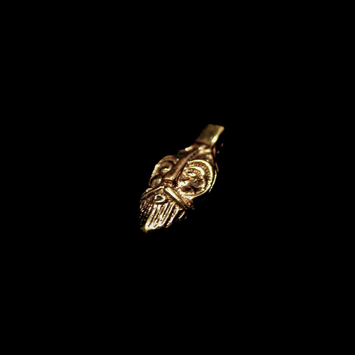 Loki, bronze pendant