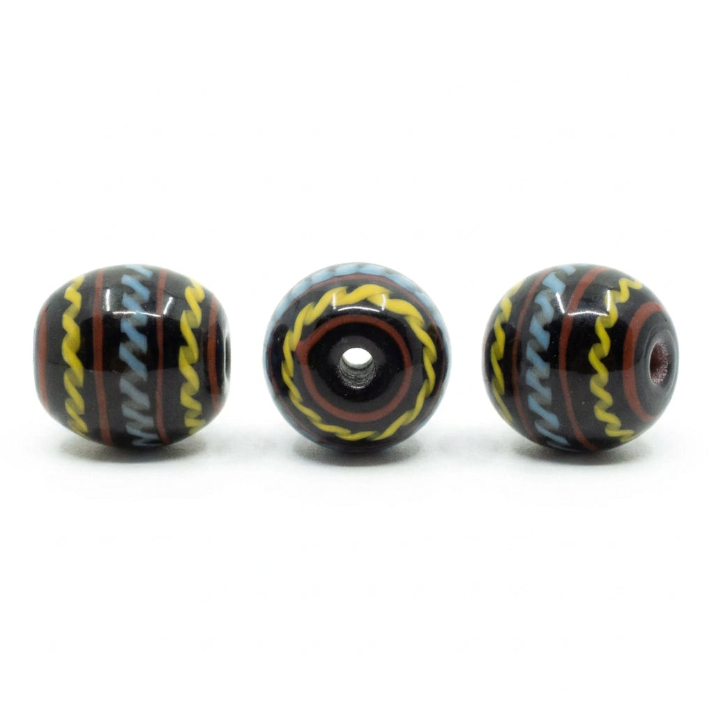 Black glass bead with decoration, glossy – three beads with a wavy pattern in blue, yellow and red