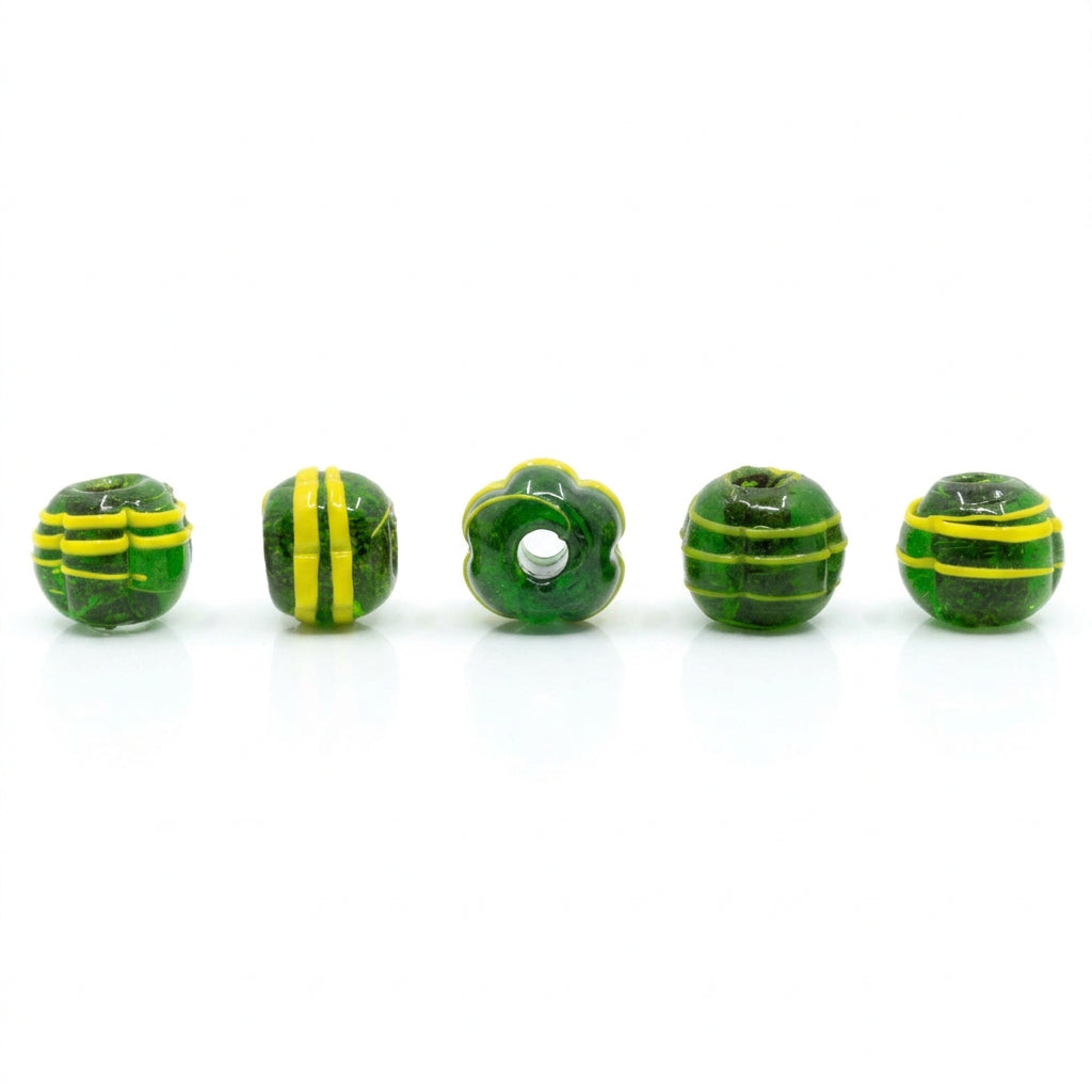 Dark green melon-shaped glass bead with yellow decor – five beads, the spiral and line pattern clearly visible